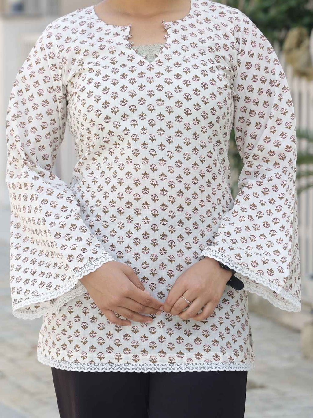 White and maroon short kurta - lace hem detail close up