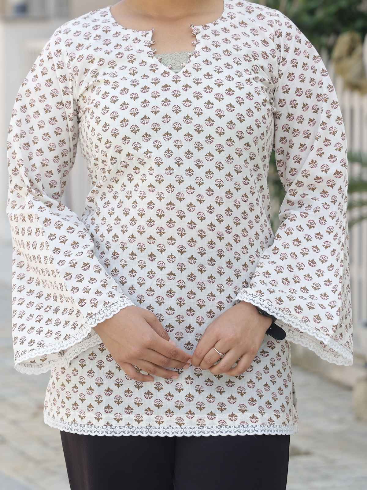 White and maroon short kurta - lace hem detail close up